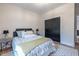 Comfortable bedroom featuring neutral walls, decorative rug, and a full bed with stylish headboard and warm toned accents at 973 Parsons Sw St, Atlanta, GA 30314