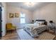 Cozy bedroom with natural light, stylish decor, a patterned rug, and hardwood floors at 973 Parsons Sw St, Atlanta, GA 30314