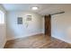 Bedroom with wood-look vinyl flooring, neutral paint and a sliding barn door at 973 Parsons Sw St, Atlanta, GA 30314