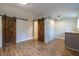 Large bonus room featuring hardwood floors, gray cabinets, and a stylish barn door at 973 Parsons Sw St, Atlanta, GA 30314