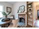 Quaint dining room with decorative fireplace, built in shelving, hardwood floors, and a inviting ambiance at 973 Parsons Sw St, Atlanta, GA 30314