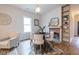 Bright dining space featuring hardwood floors, fireplace, and decorative rug for a modern touch at 973 Parsons Sw St, Atlanta, GA 30314