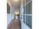 Inviting foyer with hardwood floors, showcasing a seamless transition to the home's interior and open-concept design at 973 Parsons Sw St, Atlanta, GA 30314