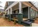 Inviting porch with wooden decking and painted columns, showcasing outdoor living space at 973 Parsons Sw St, Atlanta, GA 30314