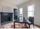 Office featuring black fireplace, hardwood flooring, a cowhide rug and plenty of light at 973 Parsons Sw St, Atlanta, GA 30314