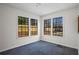 Corner bedroom with three windows overlooking the backyard and fenced in yard at 1833 Lost Mountain Rd, Powder Springs, GA 30127