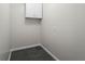 A closet with a cabinet and neutral walls provides practical storage at 1833 Lost Mountain Rd, Powder Springs, GA 30127