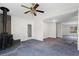 Spacious living room with a modern fireplace, creating a comfortable and inviting atmosphere for relaxation and entertainment at 1833 Lost Mountain Rd, Powder Springs, GA 30127