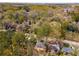 Aerial view of a property located in a wooded suburban neighborhood with mature trees at 2462 Macon Sw Dr, Atlanta, GA 30315
