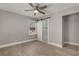 Bedroom with sliding barn door to bath, closet, and view to outside at 2462 Macon Sw Dr, Atlanta, GA 30315