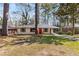 Charming single-story home with a red front door and well-maintained lawn at 2462 Macon Sw Dr, Atlanta, GA 30315