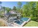 A serene home with a stunning outdoor pool and a lush green setting at 2672 Langland Ne Ct, Atlanta, GA 30345