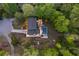 An aerial view of a backyard oasis, complete with a sparkling pool surrounded by mature trees at 2672 Langland Ne Ct, Atlanta, GA 30345