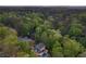 Lush canopy view of a suburban home with backyard pool and spa at 2672 Langland Ne Ct, Atlanta, GA 30345
