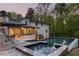 Backyard featuring a sparkling pool, hot tub, patio, and beautifully landscaped greenery at 2672 Langland Ne Ct, Atlanta, GA 30345