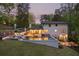An amazing backyard featuring an inviting outdoor pool, comfortable lounge chairs, and mature trees at 2672 Langland Ne Ct, Atlanta, GA 30345