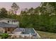 Beautiful backyard with a pool, spa, and patio, perfect for outdoor entertaining and relaxation at 2672 Langland Ne Ct, Atlanta, GA 30345