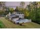 Expansive backyard with a modern pool, spa, patio and lush landscaping for luxurious outdoor living at 2672 Langland Ne Ct, Atlanta, GA 30345