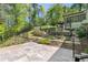 Spacious backyard featuring a patio, stairs, and landscaping, offering a perfect outdoor living and entertainment area at 2672 Langland Ne Ct, Atlanta, GA 30345