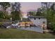 A backyard featuring an inviting outdoor pool, comfortable lounge chairs and mature trees at 2672 Langland Ne Ct, Atlanta, GA 30345