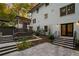 Backyard patio with stairs leading to the house, garden area, and stone tile patio at 2672 Langland Ne Ct, Atlanta, GA 30345
