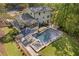 An aerial view showcasing a luxurious pool, manicured lawn, and patio area that is perfect for outdoor relaxation at 2672 Langland Ne Ct, Atlanta, GA 30345