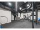 Finished basement with black ceilings, rubber flooring, gym equipment, and white walls at 2672 Langland Ne Ct, Atlanta, GA 30345