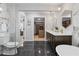 Elegant bathroom featuring a double vanity, marble walls and walk in closet at 2672 Langland Ne Ct, Atlanta, GA 30345