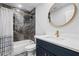 Stylish bathroom features marbled tile, gold fixtures, and a sleek vanity with white countertop at 2672 Langland Ne Ct, Atlanta, GA 30345