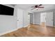 Bedroom with hardwood floors, ceiling fan, tv and mirrored closet at 2672 Langland Ne Ct, Atlanta, GA 30345