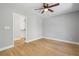 Bright bedroom featuring hardwood floors and a doorway leading to a closet at 2672 Langland Ne Ct, Atlanta, GA 30345