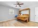 Bedroom featuring hardwood floors and a unique Murphy bed pulled down with bedding displayed at 2672 Langland Ne Ct, Atlanta, GA 30345