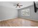 Bedroom with hardwood floors, ceiling fan and views of the green outdoors at 2672 Langland Ne Ct, Atlanta, GA 30345