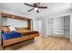 Bedroom features a Murphy bed and an adjacent closet with ample shelving at 2672 Langland Ne Ct, Atlanta, GA 30345