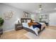 Bright bedroom featuring a ceiling fan, neutral walls, and wood flooring at 2672 Langland Ne Ct, Atlanta, GA 30345