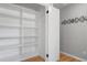 Walk-in closet with custom shelving and storage at 2672 Langland Ne Ct, Atlanta, GA 30345
