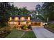 Charming two-story home with a manicured lawn, colorful landscaping, and an attached two-car garage at 2672 Langland Ne Ct, Atlanta, GA 30345