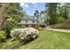 Beautiful two-story home with vibrant azaleas in the front yard, and a long driveway at 2672 Langland Ne Ct, Atlanta, GA 30345