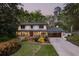 Inviting two-story home with manicured lawn, beautiful landscaping and an attached two-car garage at 2672 Langland Ne Ct, Atlanta, GA 30345