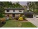 Inviting two-story home with a brick walkway, lush landscaping, and a covered porch for curb appeal at 2672 Langland Ne Ct, Atlanta, GA 30345