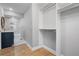 Hallway featuring hardwood floors, a bathroom and an open closet at 2672 Langland Ne Ct, Atlanta, GA 30345