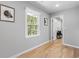 Hallway with hardwood floors, a window, and access to other rooms at 2672 Langland Ne Ct, Atlanta, GA 30345