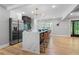 Open-concept kitchen featuring a large island with seating, stainless steel appliances, and modern finishes at 2672 Langland Ne Ct, Atlanta, GA 30345