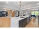 Bright kitchen with an island, stylish lighting, modern appliances, and open access to the living and dining areas at 2672 Langland Ne Ct, Atlanta, GA 30345