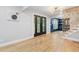 Spacious living area showcasing hardwood floors, modern lighting, and a view into the adjacent office space at 2672 Langland Ne Ct, Atlanta, GA 30345