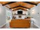 Cozy living room with wood-paneled ceiling and stylish brick fireplace at 2672 Langland Ne Ct, Atlanta, GA 30345