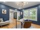 Stylish office space with ample natural light, a sleek desk, and a view of the front yard at 2672 Langland Ne Ct, Atlanta, GA 30345