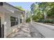 Beautiful stone patio along a white brick wall, offering a serene outdoor space with landscaping and privacy fencing at 2672 Langland Ne Ct, Atlanta, GA 30345