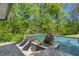 Stunning backyard pool with lounge chairs and lush greenery at 2672 Langland Ne Ct, Atlanta, GA 30345