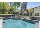This backyard pool and sunroom are perfect for relaxing and entertaining at 2672 Langland Ne Ct, Atlanta, GA 30345